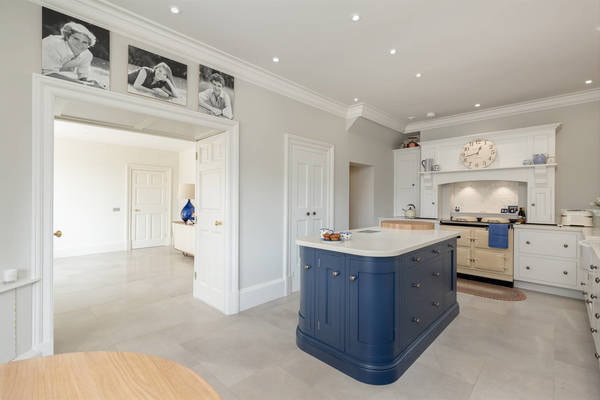 Class kitchen design in pale slate and navy