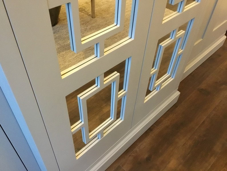 Geometric design on mirrored wardrobe doors