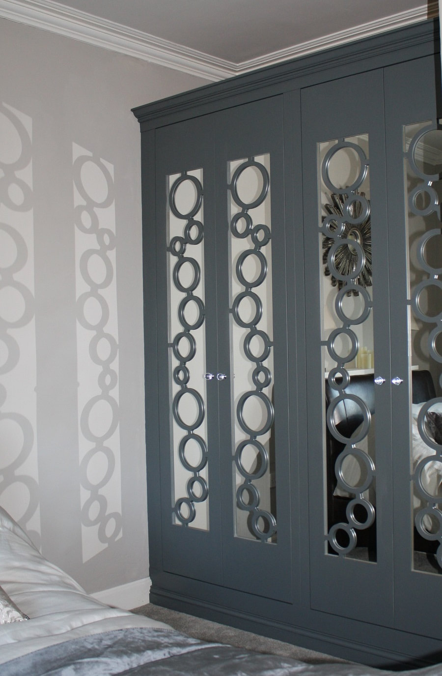Bespoke wardrobes with circles on mirrored doors