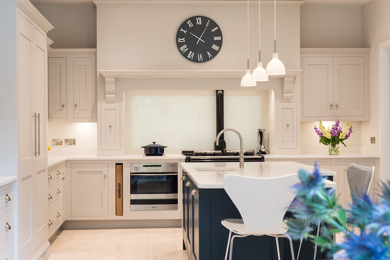 Bespoke kitchen design with neutral and bold colour Island.