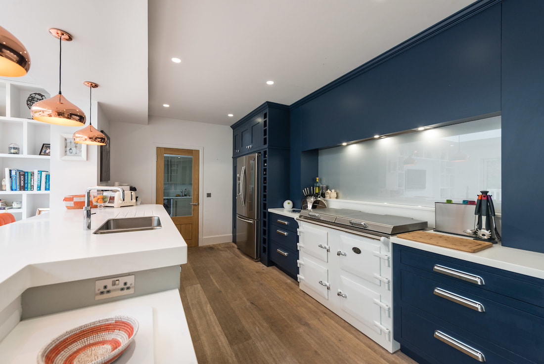 Modern open plan kitchen hand painted in navy and grey