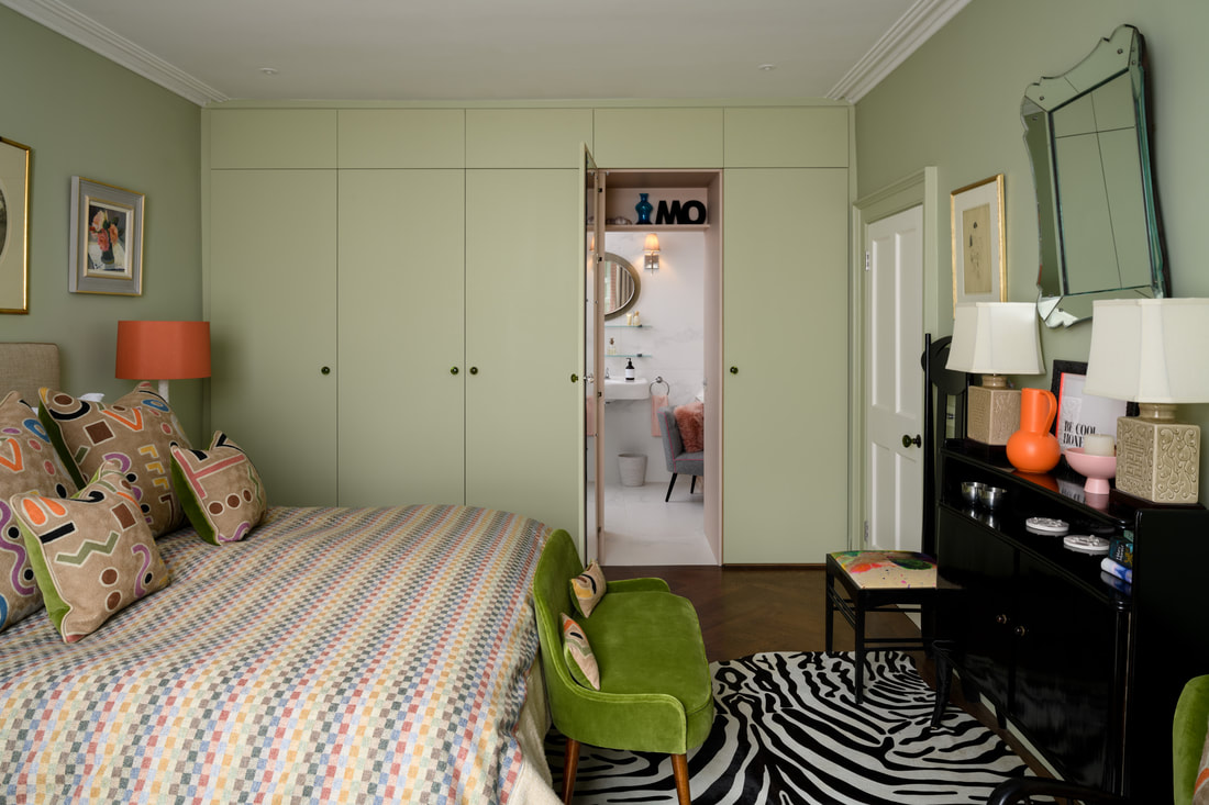 Hidden door to en suite through wardrobes by Christopher Howard